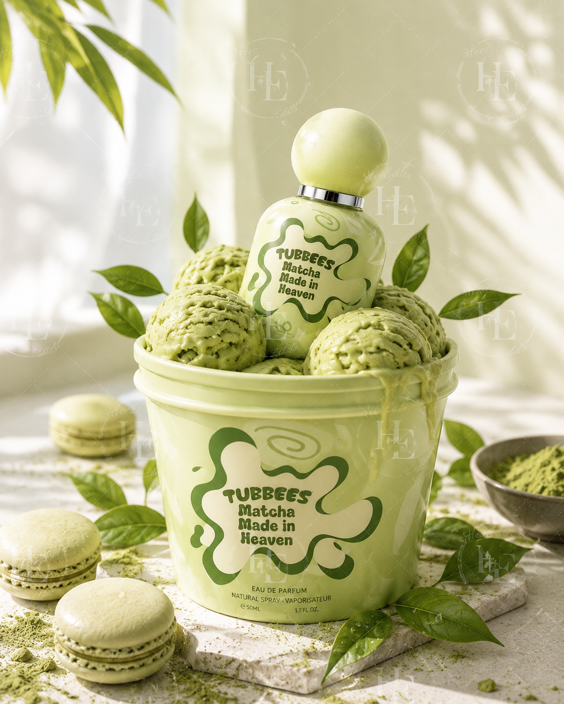 A light green tub of matcha ice cream with a branded bottle on top, styled with green leaves, macarons, and a small bowl of matcha powder on a bright white surface.