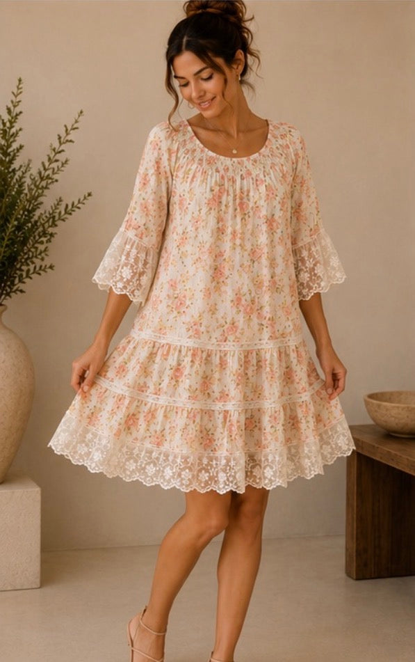 Woman wearing a floral dress in a minimal indoor setting